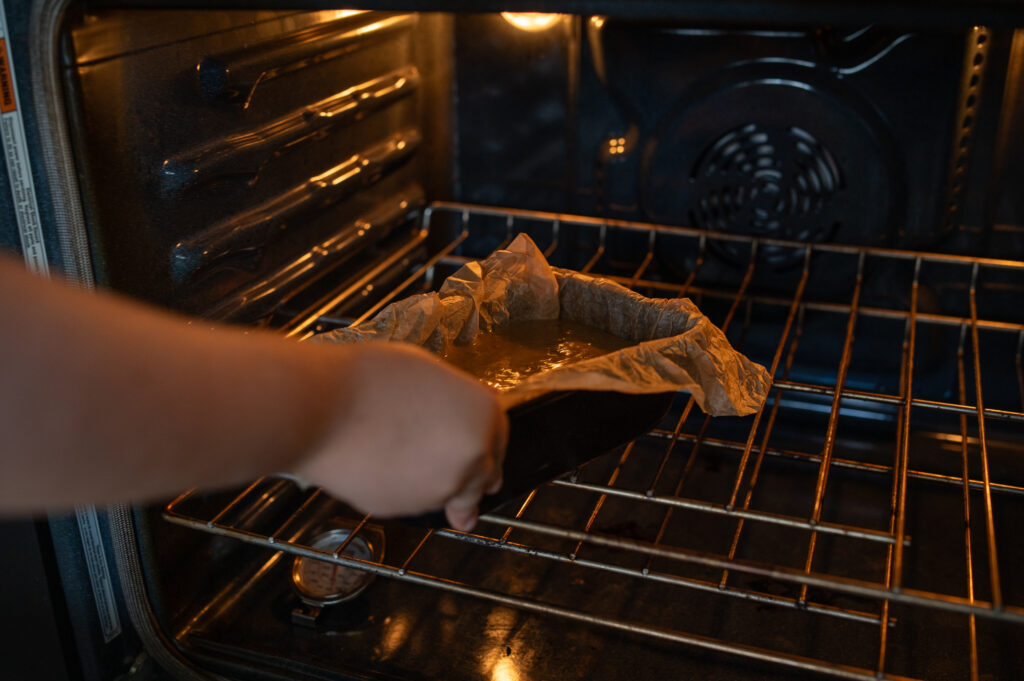 putting banana bread into hot oven 